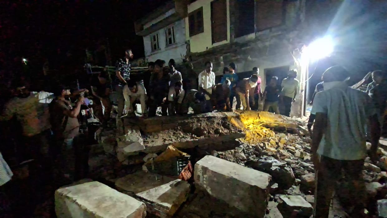 70-year-old dilapidated building collapses; two people injured.