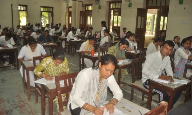 Two female students caught cheating from a model paper during the B.Ed. exam.