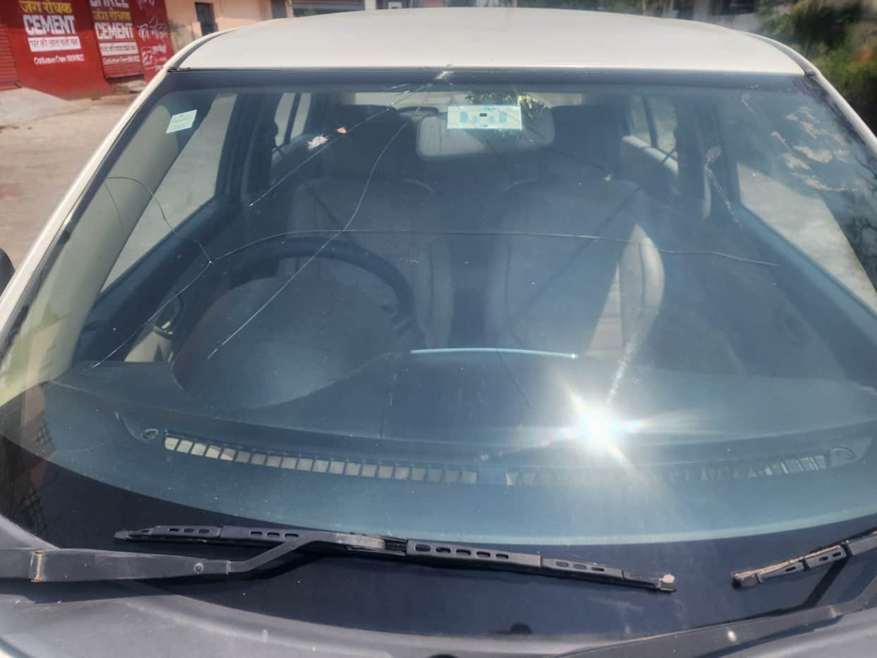 Windows of three cars parked in the street were smashed.