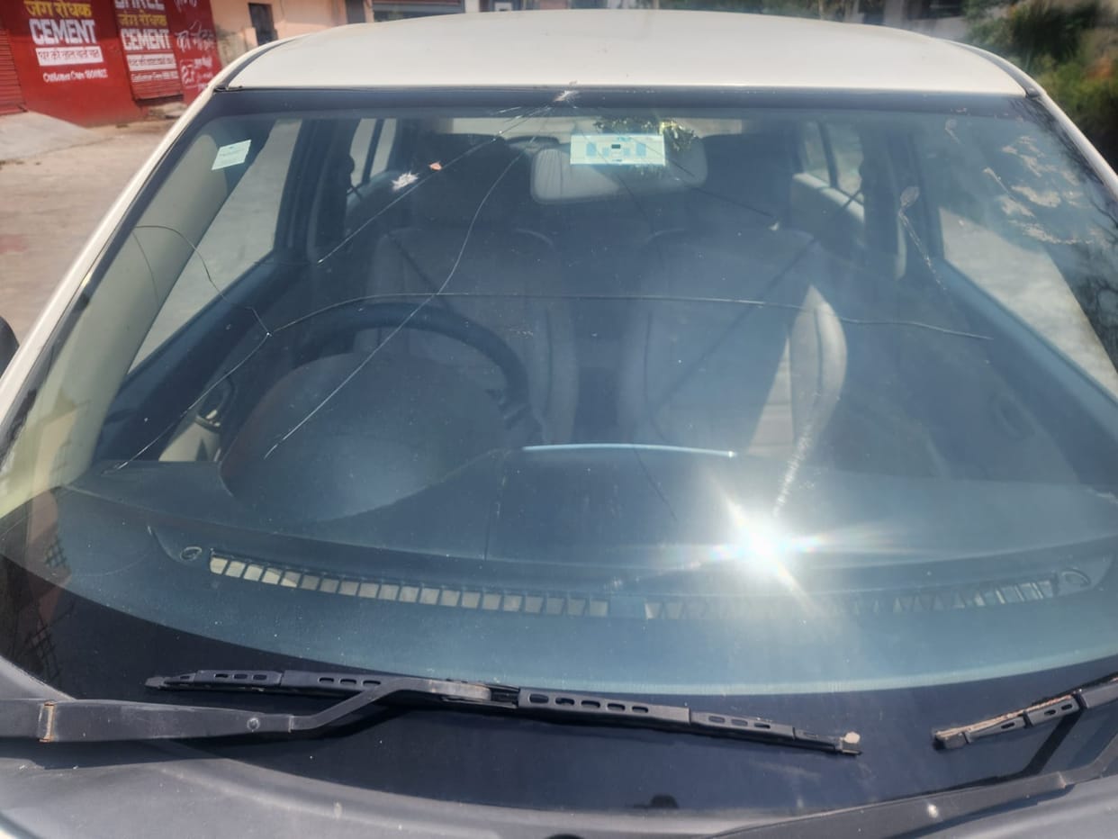 Windows of three cars parked in the street were smashed.