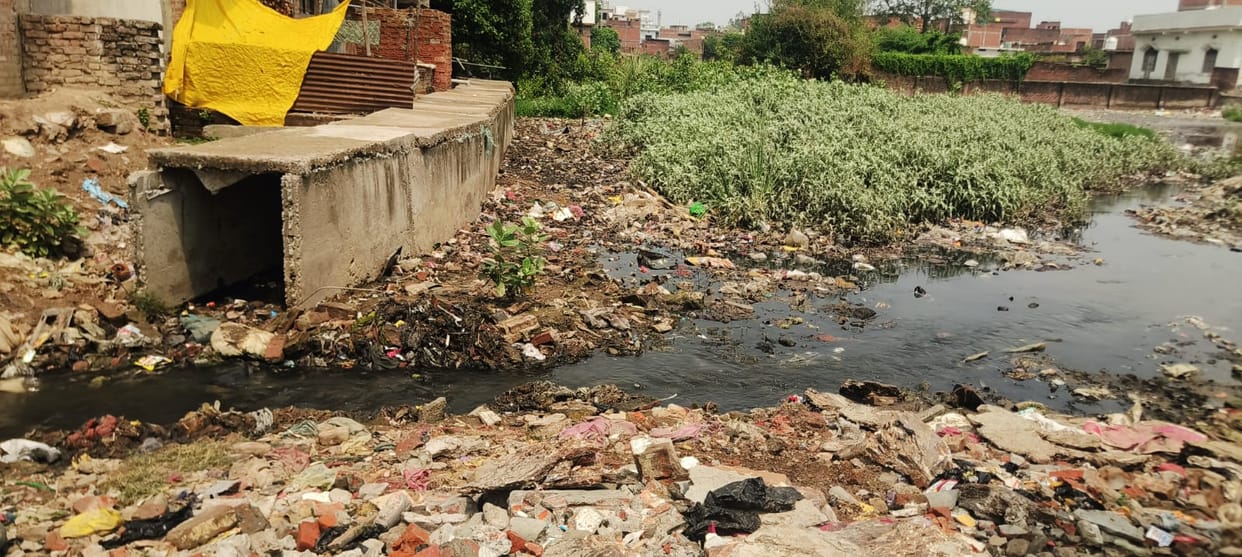 Waterlogging in the Dalit settlement of Kopaganj; encroachment on the drain.