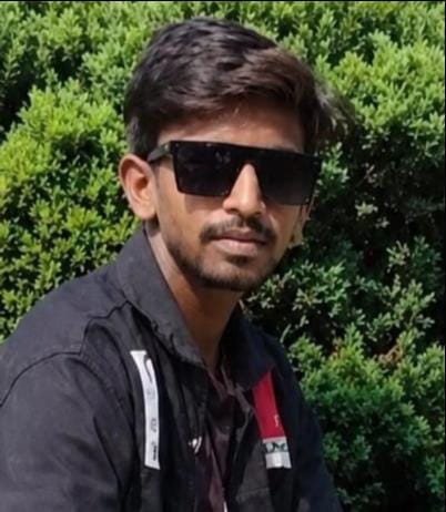 Bike crashes into stationary truck; youth dies.