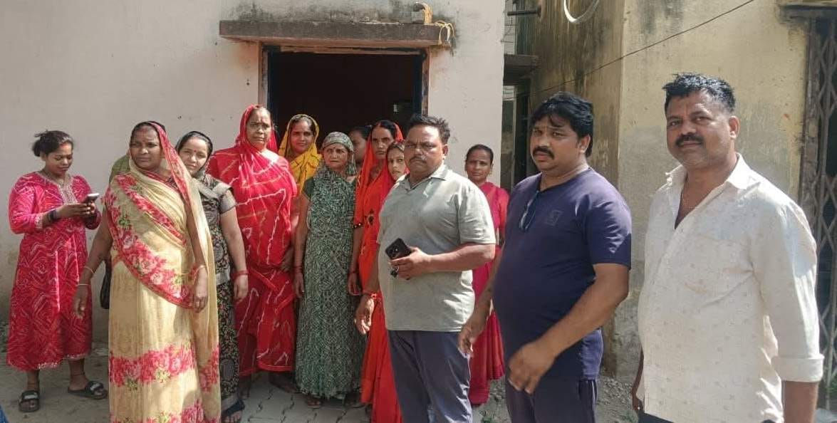 Women arrived to lock the water tank after a four-day disruption in the water supply.