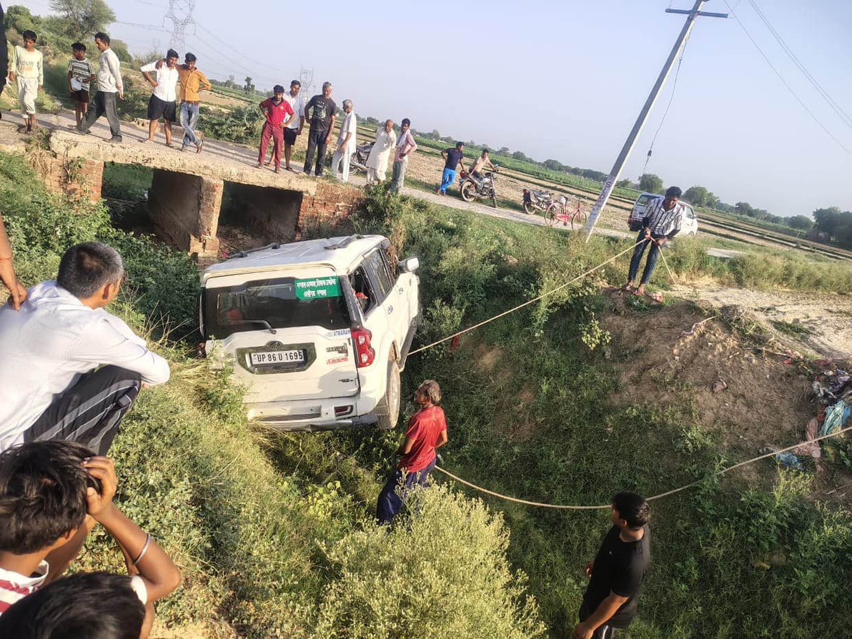 Scorpio car falls into distributary; driver injured.