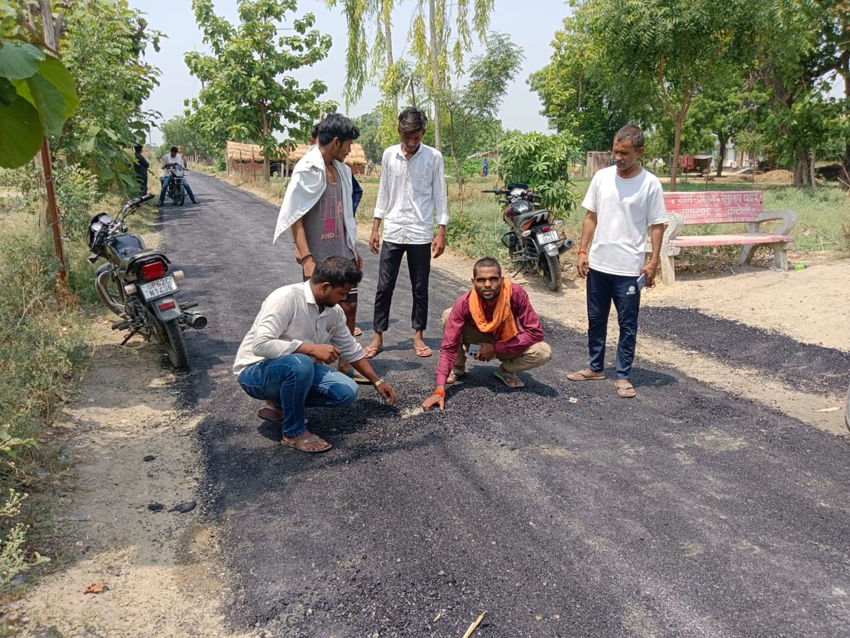 Layer of 1 cm being laid instead of 2.5 cm; villagers halt road repair work.