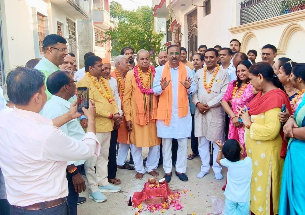 Local residents laid the foundation stone for road construction work.