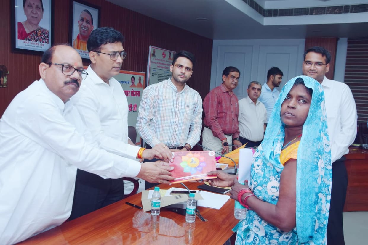 Financial assistance provided to 25 beneficiaries; faces light up with joy.