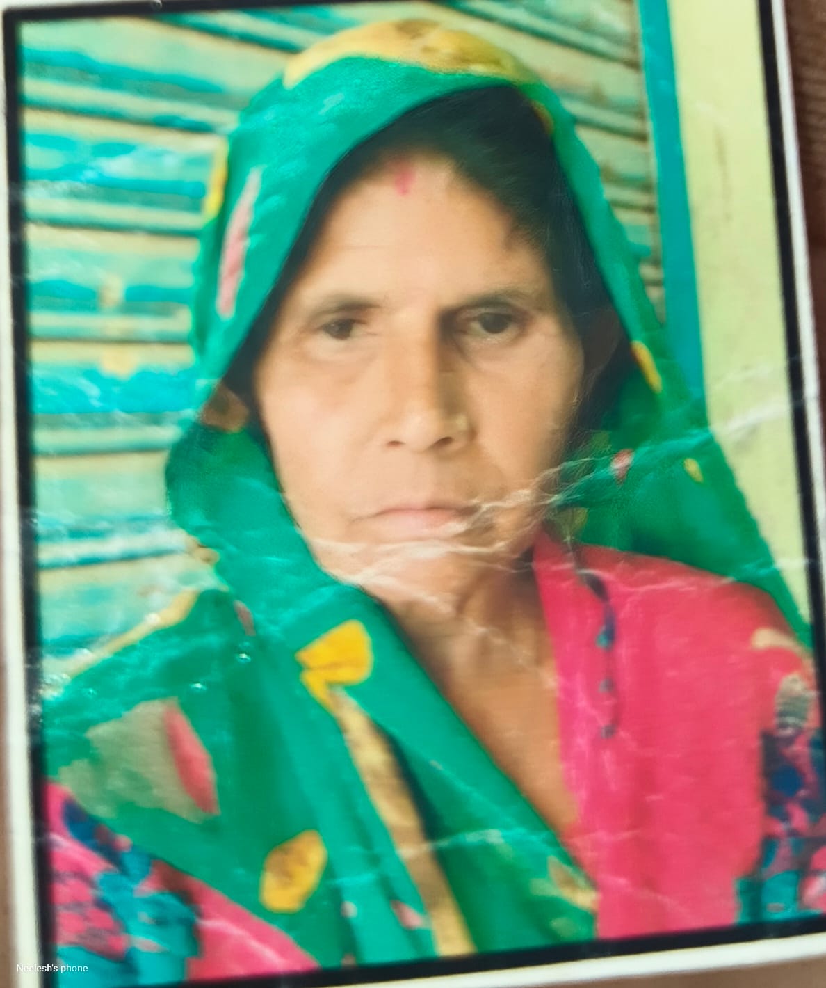 Elderly woman beaten to death in dispute over driving a tractor through maize spread on the road.