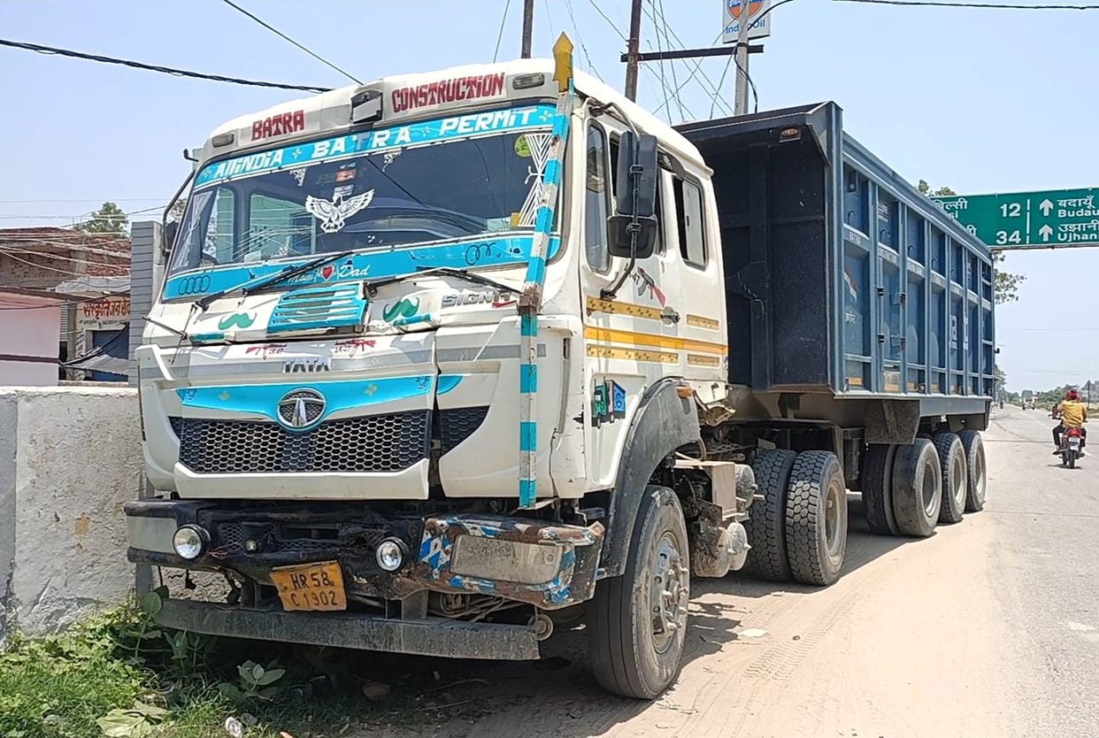 Teenager dies after being flung onto the road and run over by a dumper following a collision; two others injured.