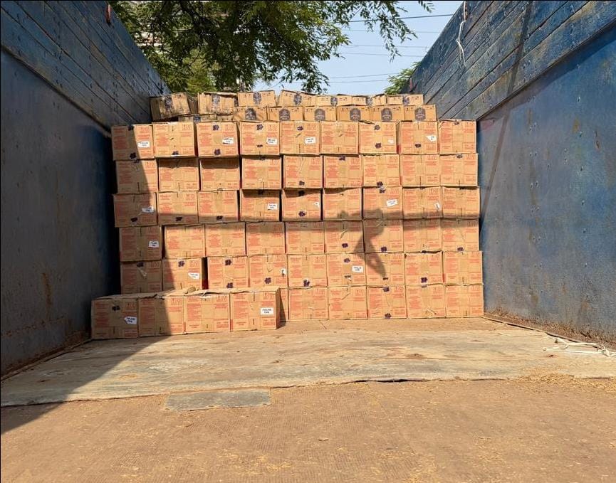 400 cases of Indian-made foreign liquor were being smuggled, concealed within paddy husk.