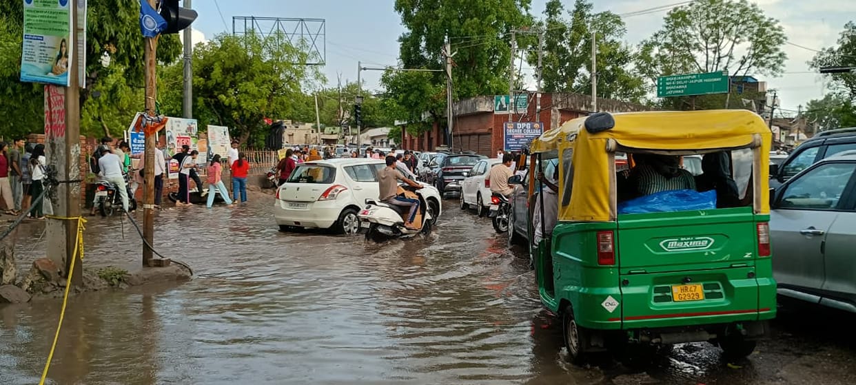 Twenty minutes of rain exposed the city's reality; roads turned into ponds, and the power went out.