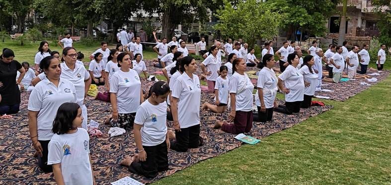 City adorned with yoga mudras; message of wellness resonates.