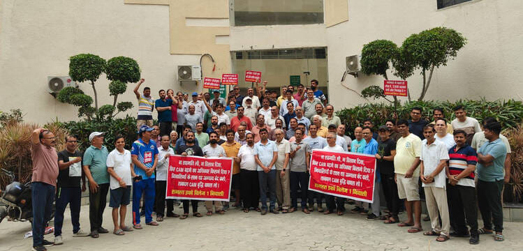 Residents protest against the 89-paise hike in maintenance charges.