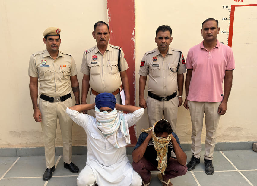 Police chased down and apprehended the robbers in the fields.
