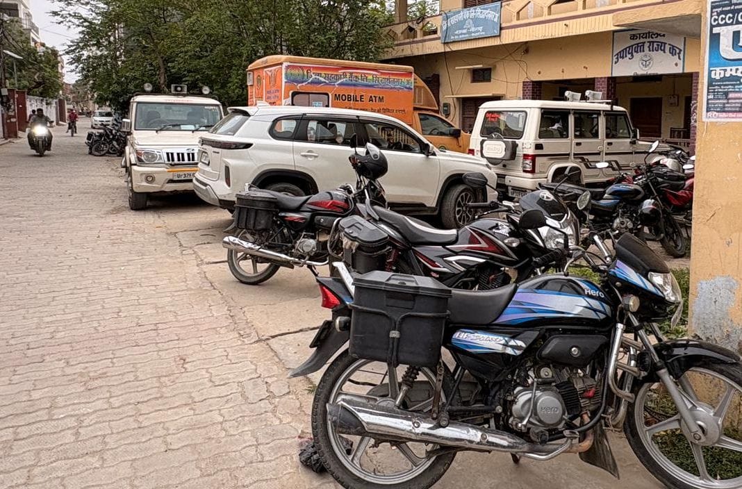 No parking available, vehicles on the footpath... pedestrians struggle to find a way.