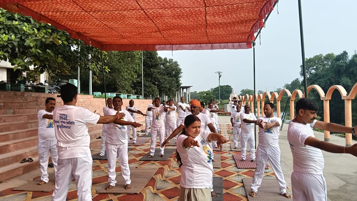 Message of healthy living conveyed through a collective yoga session.