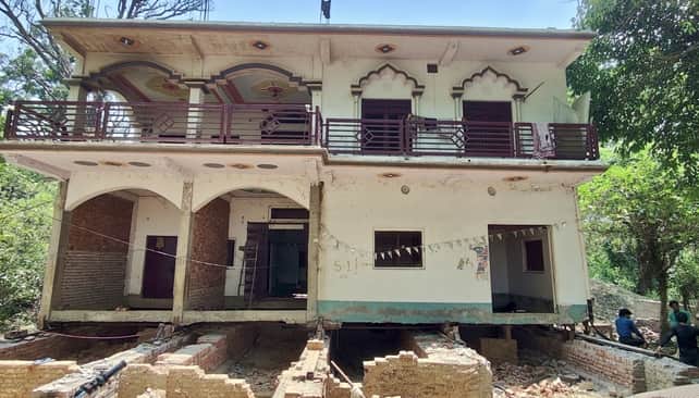 Two-storey building shifted back by 48 feet