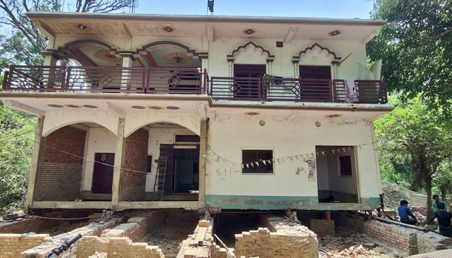 Two-storey building shifted back by 48 feet