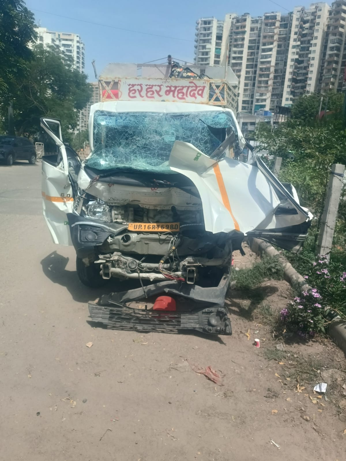 Pickup truck heading to Noida after a dip in the Ganges collides with a bus; driver dies, 13 pilgrims injured.