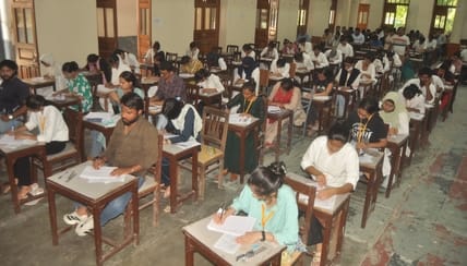 Three students caught cheating from model papers during the B.Ed. exam.