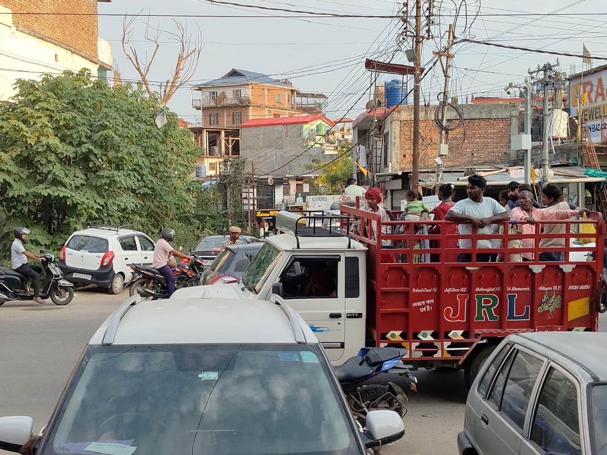 Passengers being openly transported in goods vehicles.