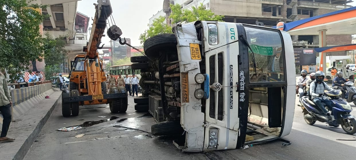 A bus full of passengers collided with the divider of a flyover and overturned.