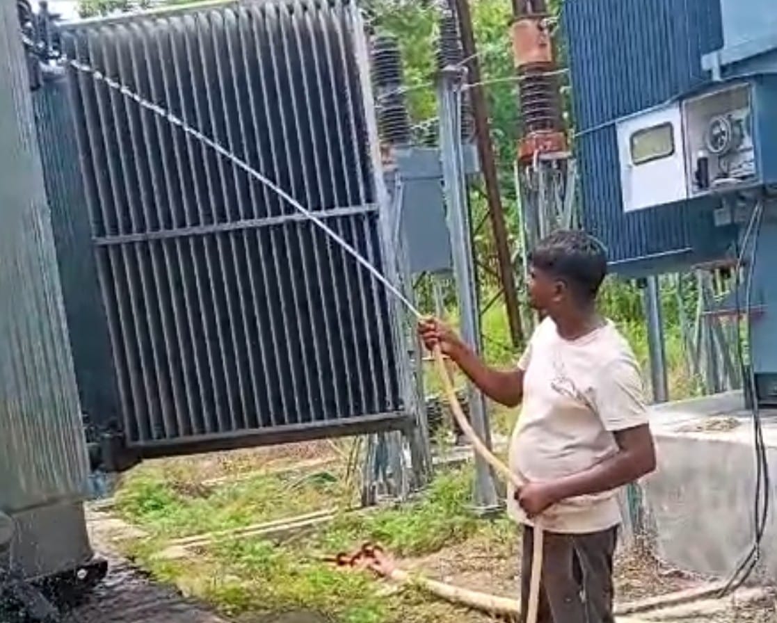 The transformer is being cooled by pouring water on it.