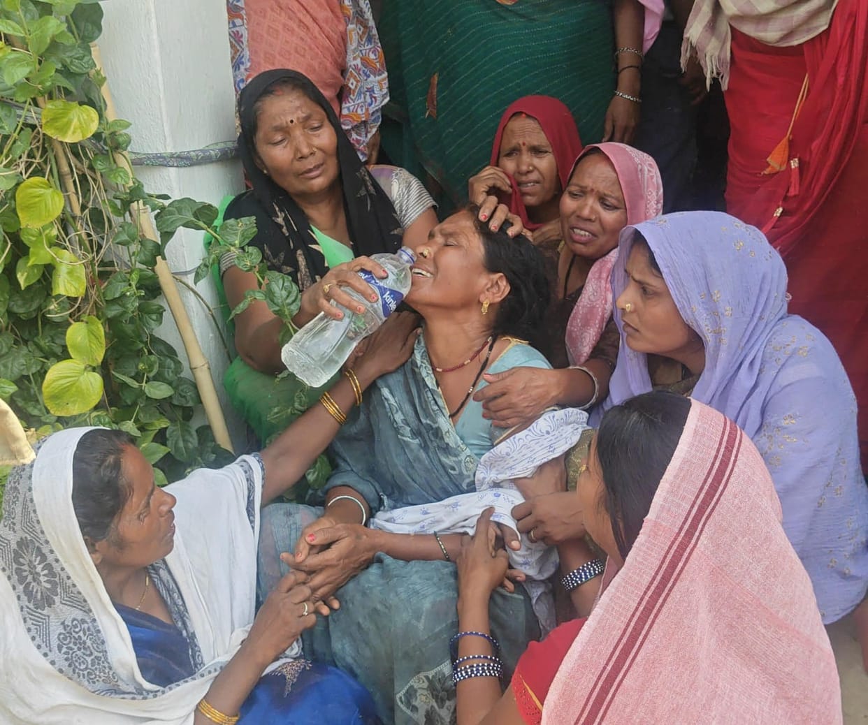 Married woman commits suicide by hanging herself.
