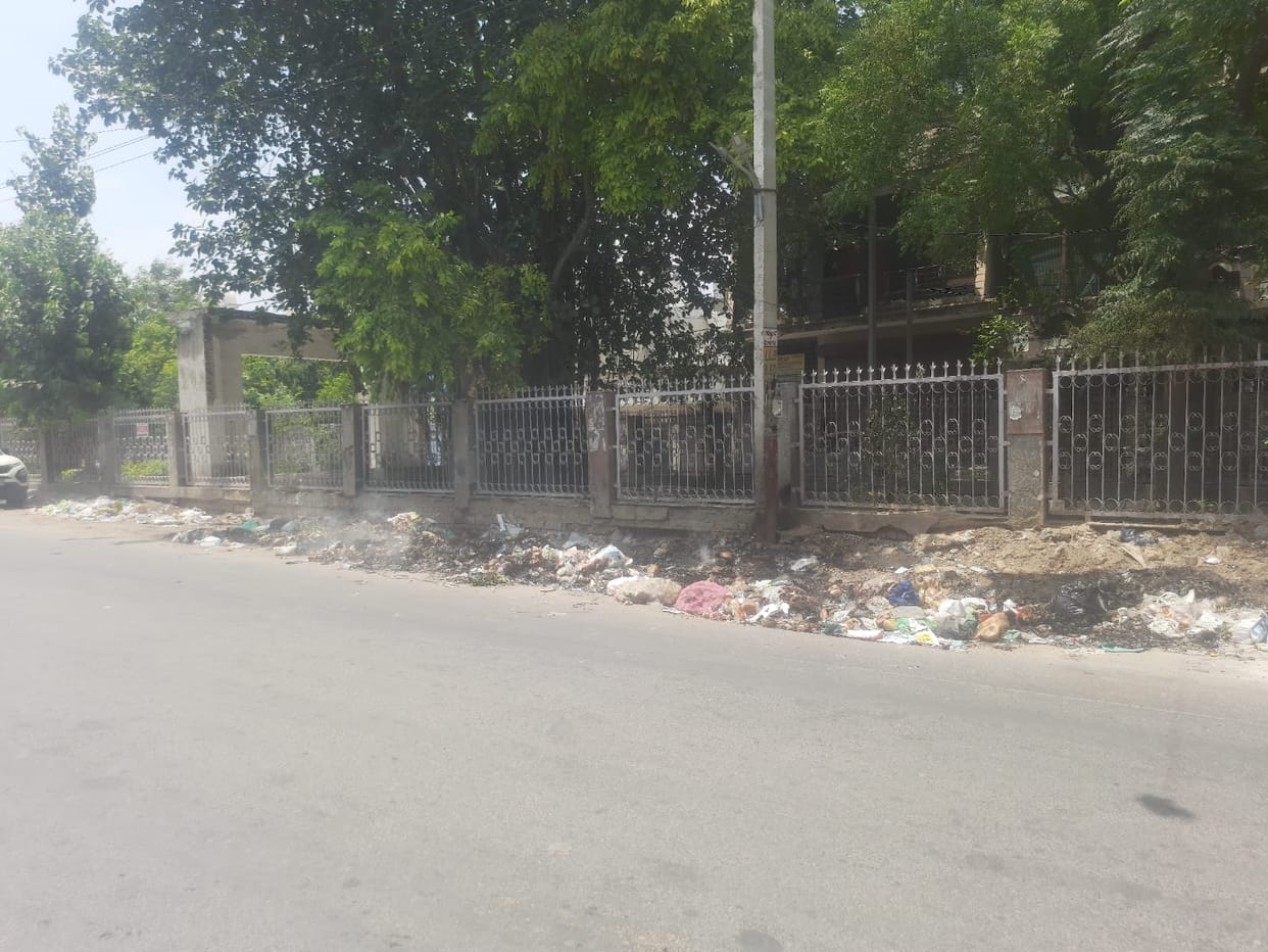 Laxity in door-to-door garbage collection; heaps of waste being burnt at collection points.