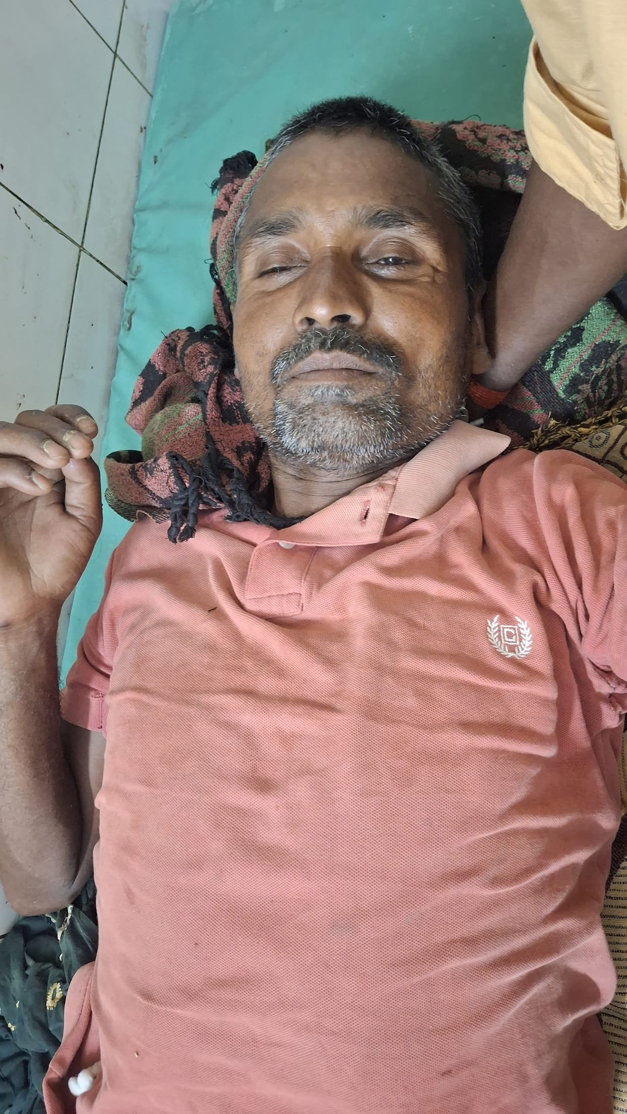 Laborers snatched a young man's life back from the jaws of a crocodile.