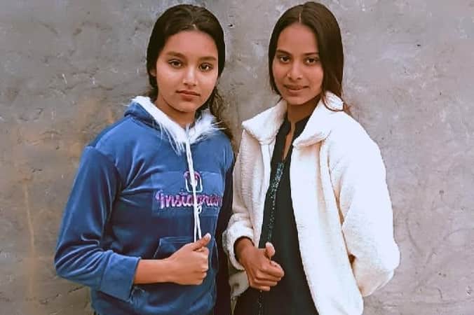 Two sisters riding a bike die after being hit by a container truck.