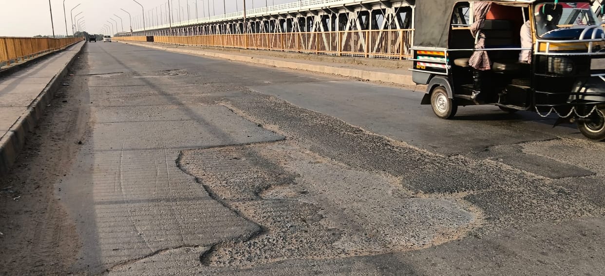 Potholes on the surface of Hamid Setu; fear of accidents.