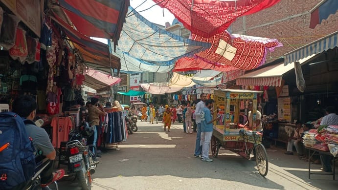 Traders rally, express outrage over the towing of customers' vehicles.