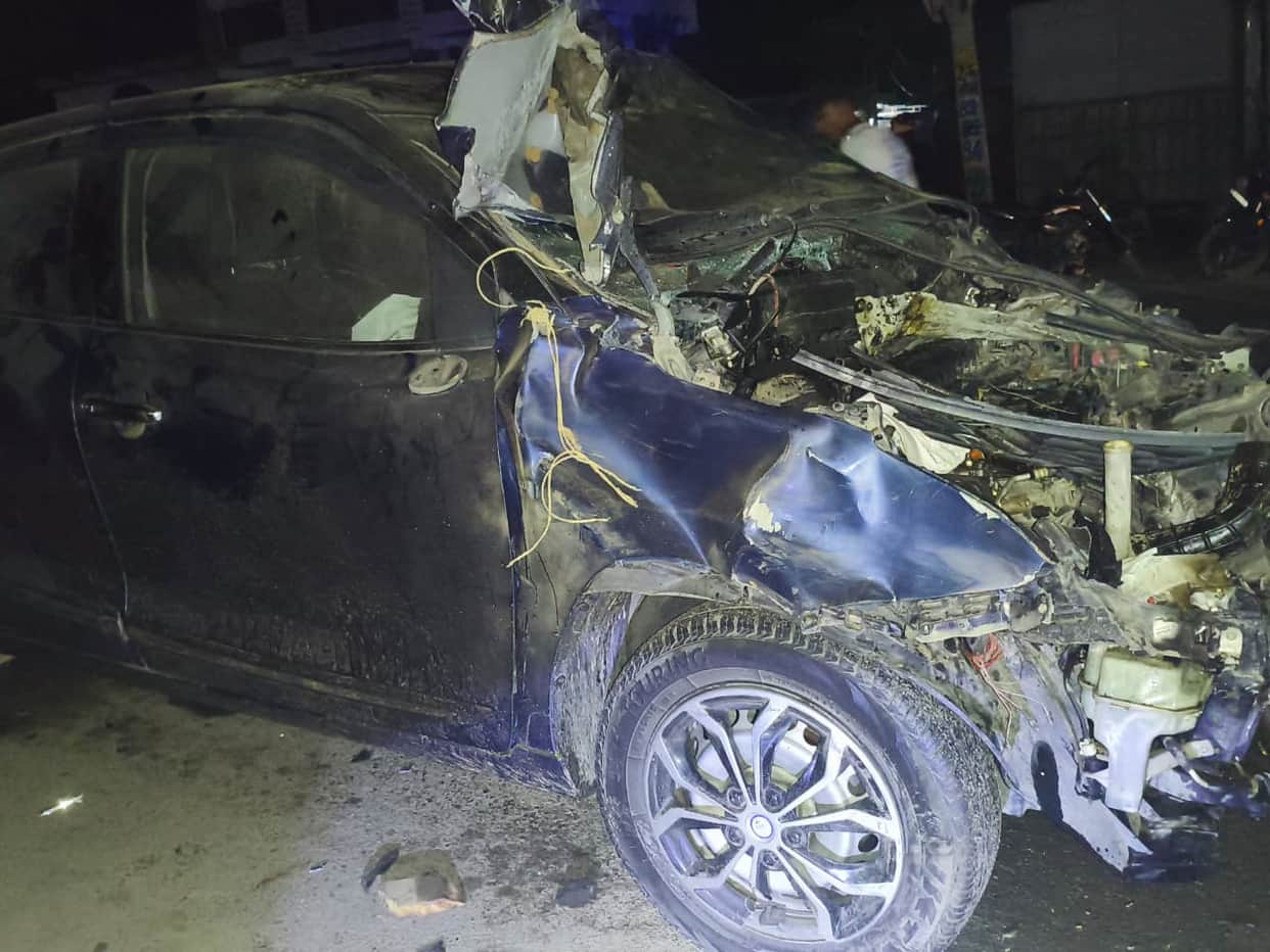 Another car collided with a parked car and overturned, injuring the driver