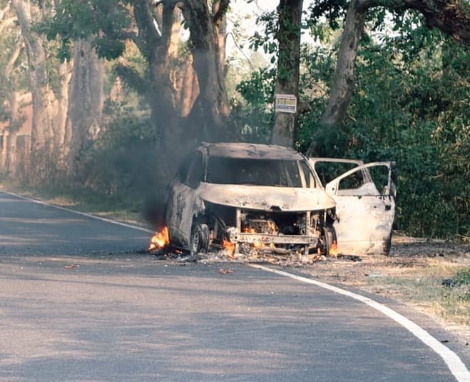 Moving car turns into a fireball; driver saves eight lives.