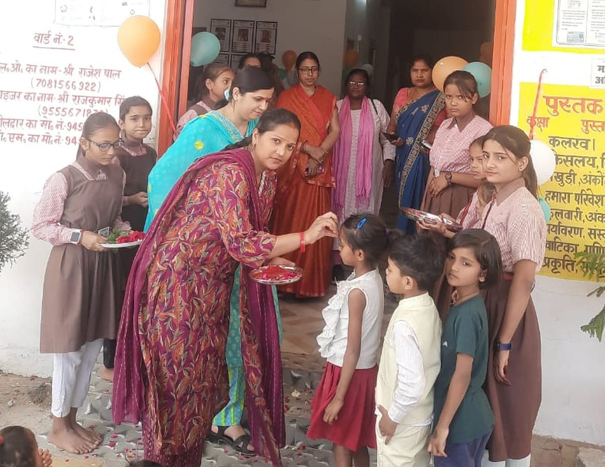 Welcomed the children with a tilak.