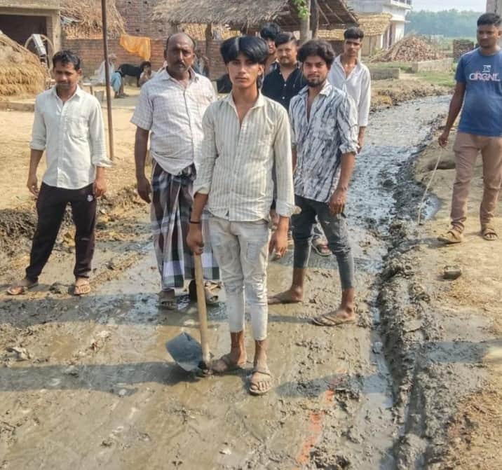 Villagers cleaned up the road, which was littered with filth