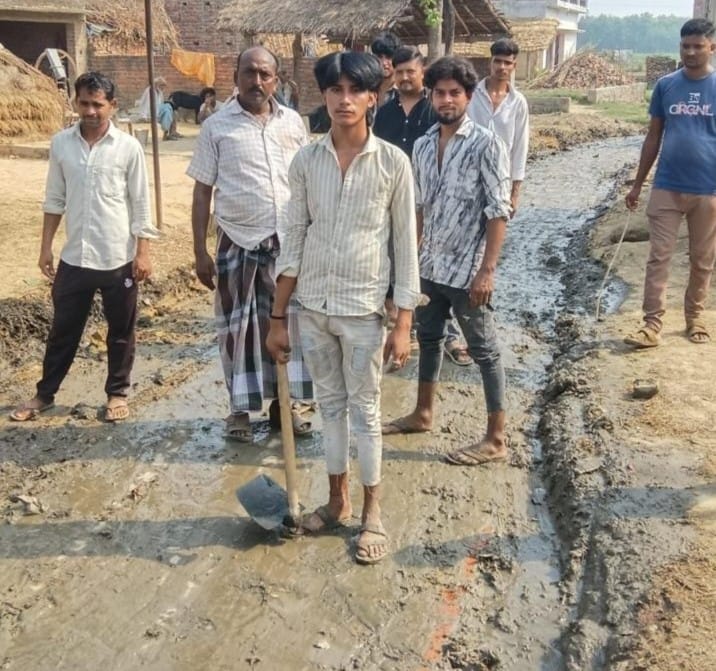 Villagers cleaned up the road, which was littered with filth