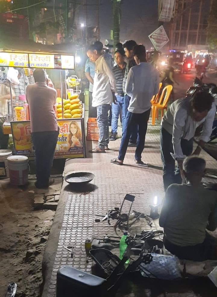 Shopkeepers encroach upon the footpath of the newly constructed four-lane road.