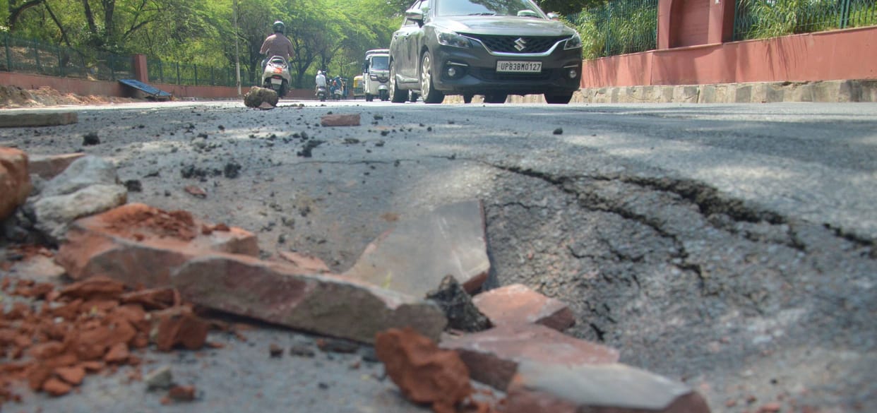 Road laid just a day ago caves in again in front of Shahjahan Park.