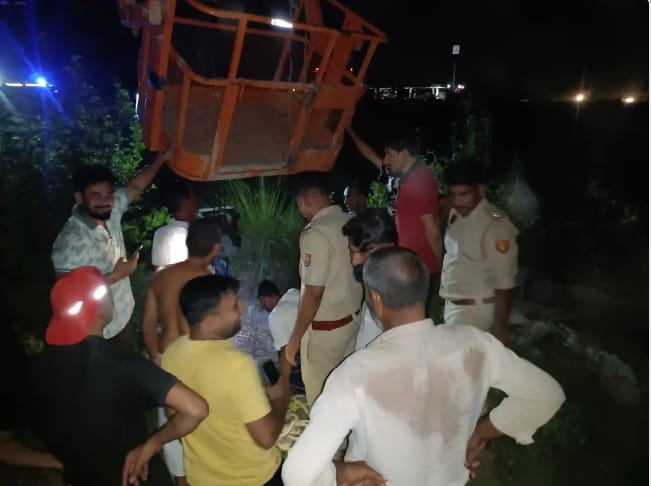Bull injured after falling into a 20-foot-deep dry well; rescued using a JCB.