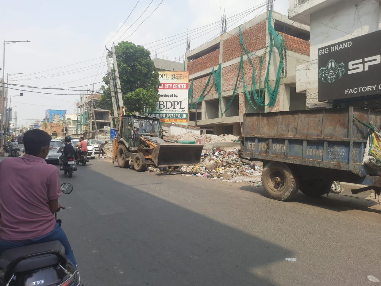 Garbage collection started by hiring dozers and tractor-trolleys
