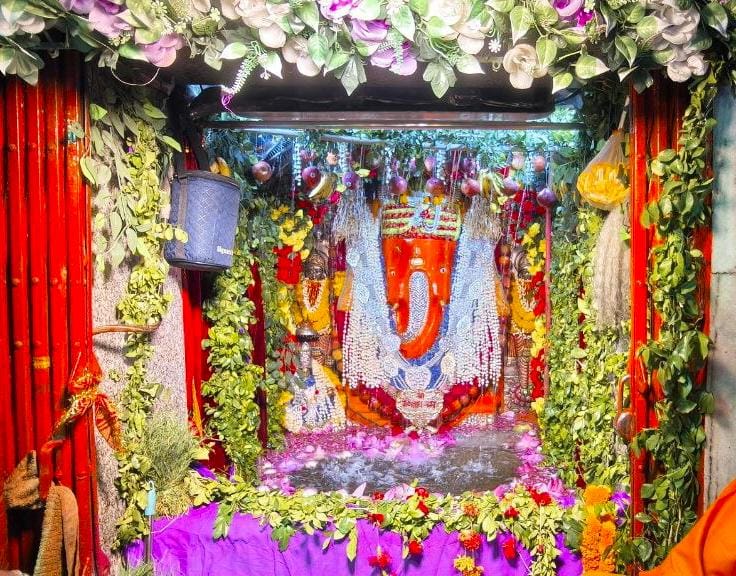 Tableau of Lord Durg Vinayak's water excursion; 251 kg of laddus offered