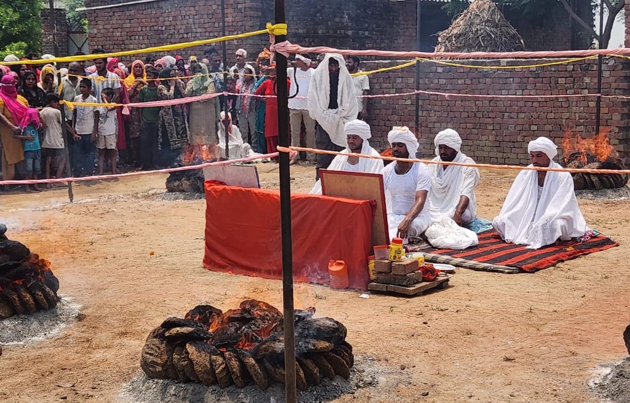 Guru Manjeet is performing penance and praying for happiness and prosperity.