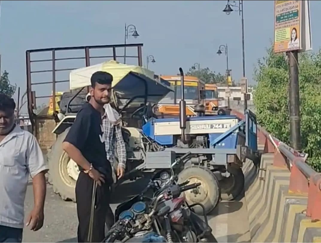 Trolley overturns after tractor axle breaks; youth injured.