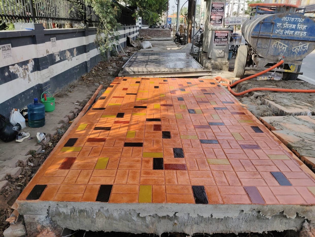 Attractive footpaths being constructed on Ramghat Road using the stamped concrete technique