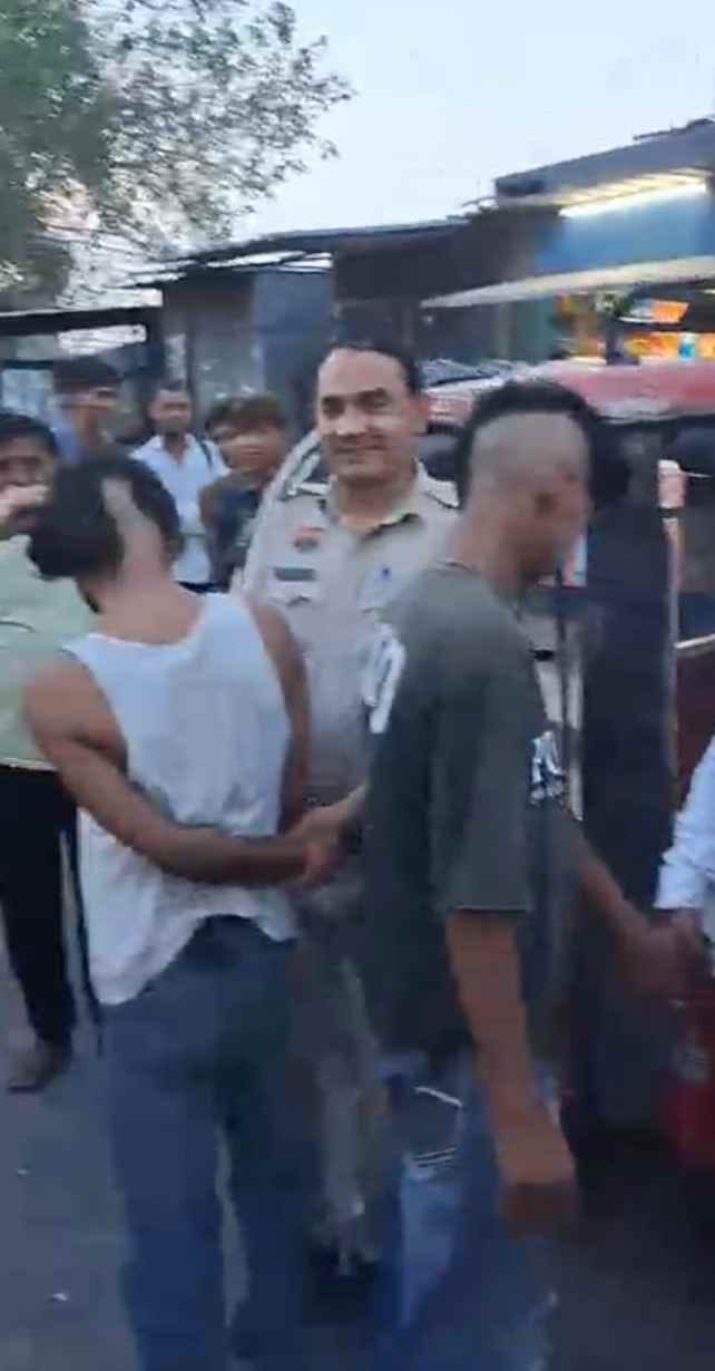 Three boys were paraded through the market with half the hair on their heads shaved off after being accused of stalking girls.