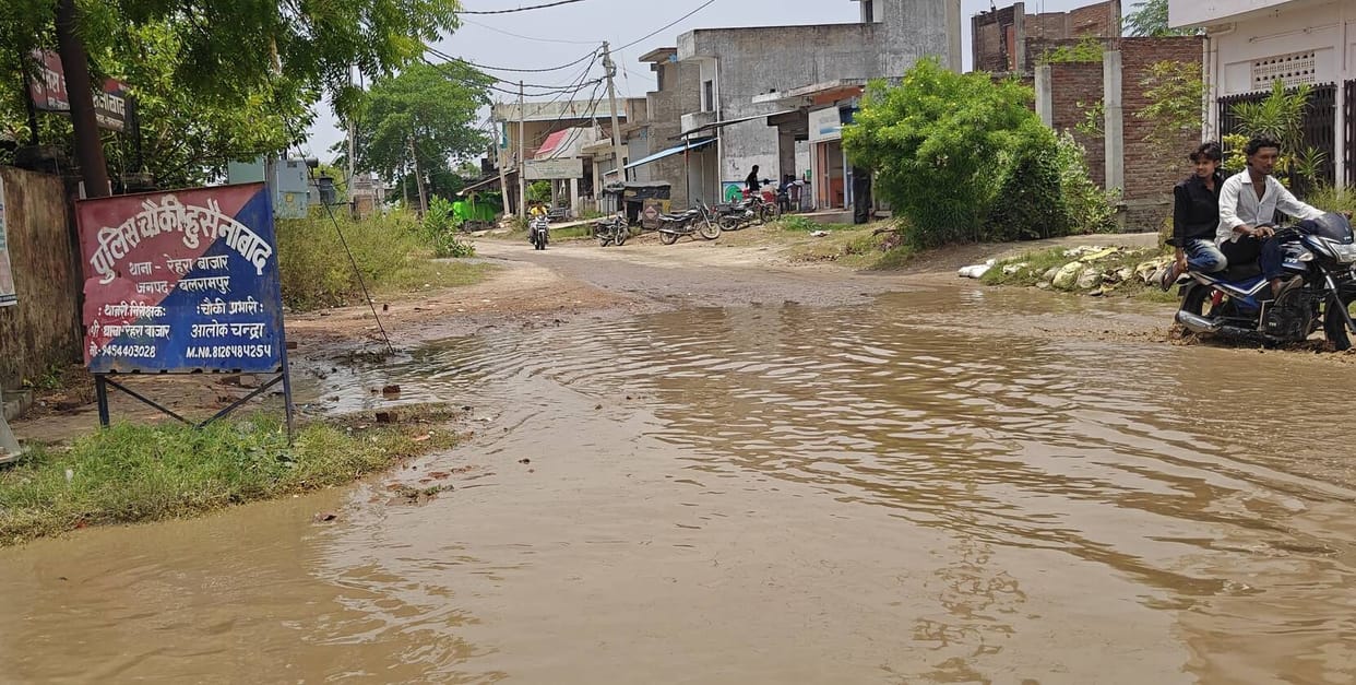 The road in front of the Husainabad police outpost submerged in light rain