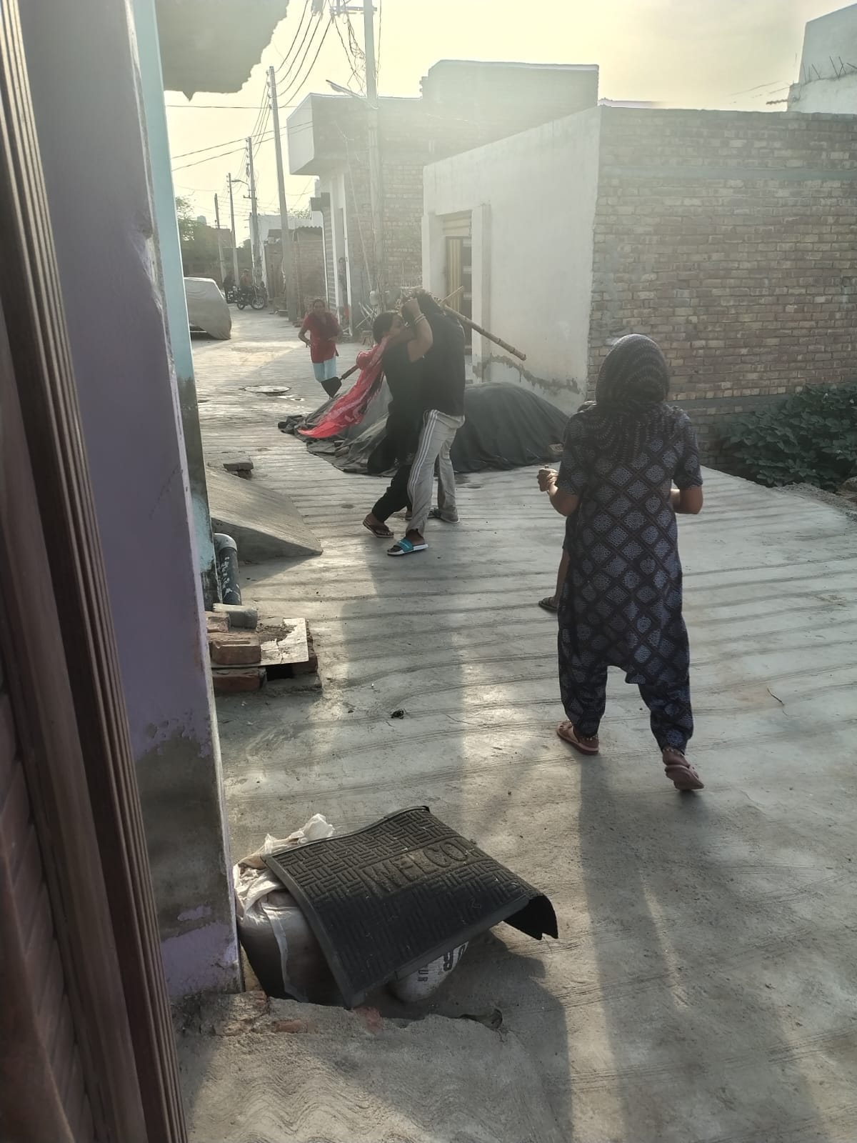 Woman dragged and beaten by neighbours, video goes viral