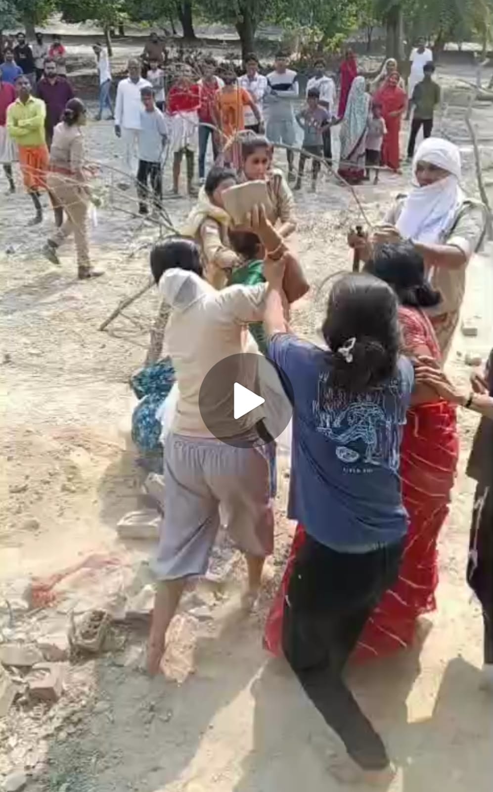 Police team stoned while conducting land measurement; female constable knocked down, beaten, and rendered unconscious after being strangled.